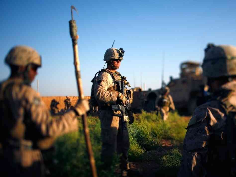 Marines pause during an operation earlier this month in Marjah, Helmand Province, Afghanistan.