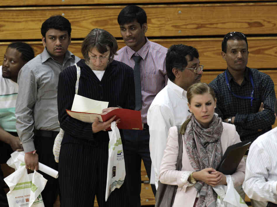 Job seekers in line at a job fair in Michigan. Job seekers in line at a job fair in Michigan.