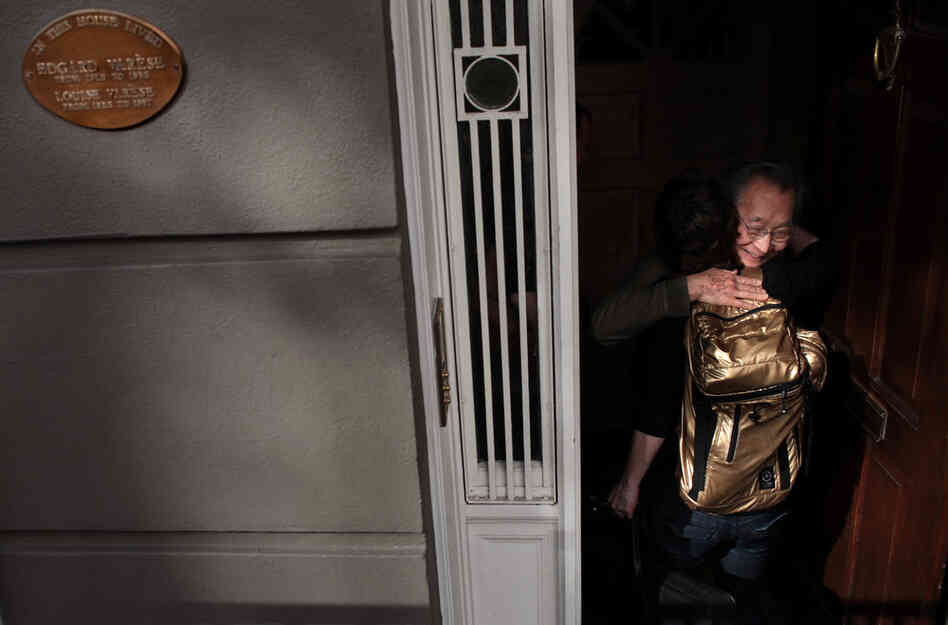 Chase is embraced by composer Chou Wen-chung when she arrives at his home in SoHo. A plaque outside commemorates Chou's teacher, legendary avant-garde composer Edgard Varese, who used to live there.