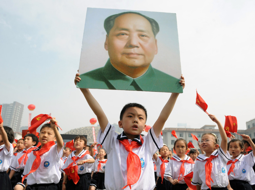 Thousands of Chinese students holding Communist flags and a portrait of China's late leader Mao Zedong mark the 90th anniversary of the founding of China's Communist Party. Celebrations like this one come during a controversial moment, as leftist groups push back at criticism of Chairman Mao and the millions of deaths he caused.