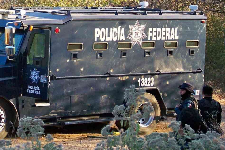 Killed Dec. 9, 2010: Nazario Moreno Gonzalez, the founder and leader of the cultlike La Familia cartel, is slain by federal police after a two-day shootout. Federal police officers stand near a bullet-riddled vehicle a day after the operation in Apatzingan, Mexico. 
