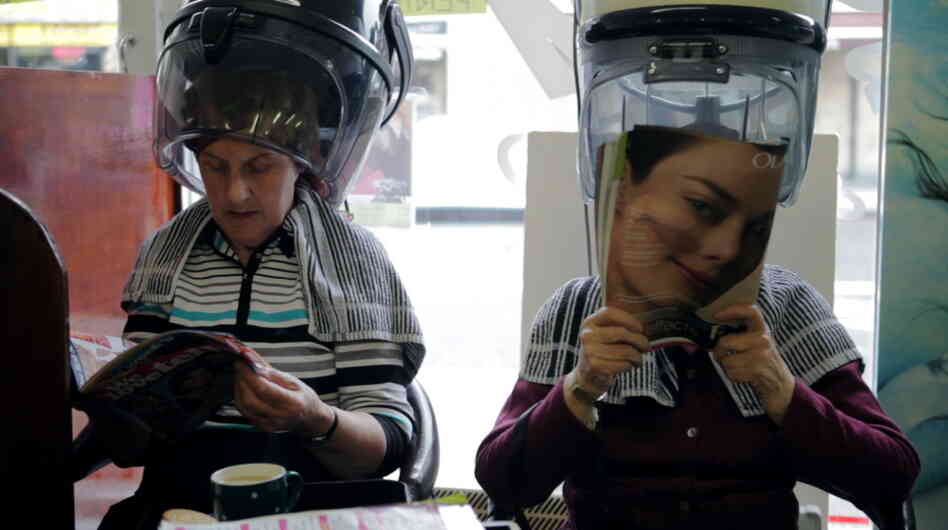Two women relax under the hair dryers in the delightful Blue Rinse.