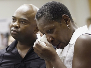 Elaine Riddick sits with her son, Tony Riddick, at a hearing before a state panel in Raleigh, N.C., on Wednesday. Elaine Riddick sits with her son, Tony Riddick, at a hearing before a state panel in Raleigh, N.C., on Wednesday.