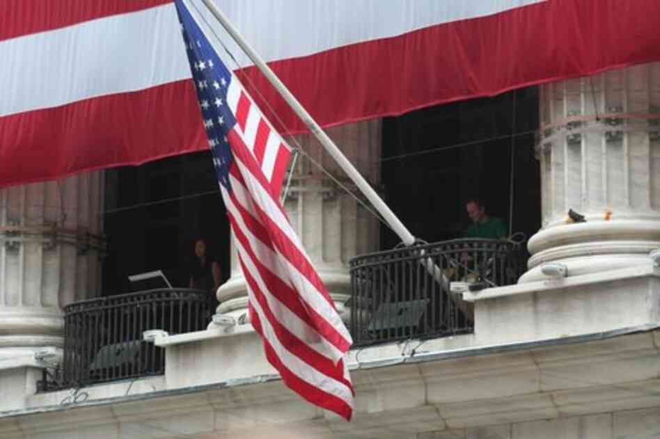 Players from the group Yarn/Wire play Louis Andriessen's 'Hoketus' from the balconies of the New York Stock Exchange on Wall Street.