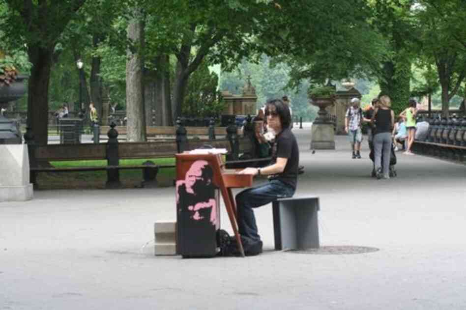 Japanese pianist Taka Kigawa at the guerilla piano near the bandstand in the middle of Central Park.
