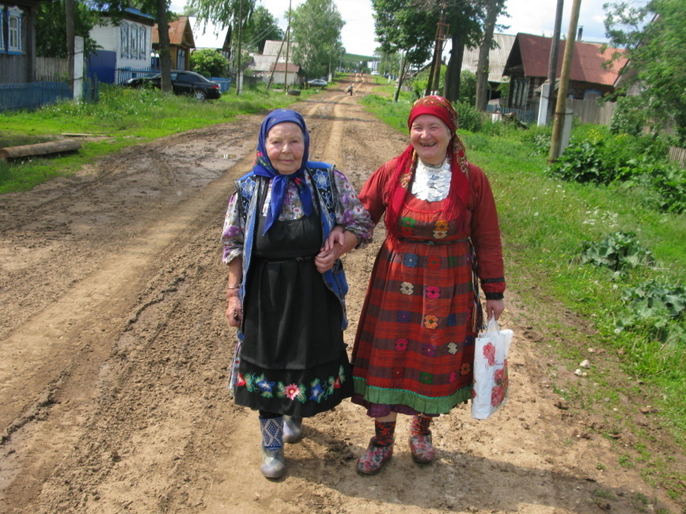 Elizaveta Zarbatova (left), who walks with Alevtina Begisheva, is the oldest member of the group at 84. She was widowed in 1957 when her husband was  electrocuted on the job.                           "After I lost my husband, I received some kind  of gift – the ability to compose music," she says. "The music comes from the heart. The suffering  comes right from my heart."