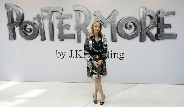 Author J.K. Rowling poses for photographers as she announces her new website project, Pottermore, at the Victoria and Albert Museum in London. Rowling says she has written new material about the characters, places and objects in the Harry Potter stories that will appear exclusively on the Pottermore site.