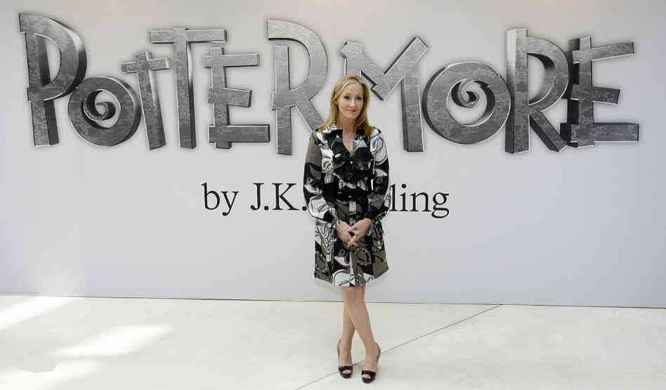 Author J.K. Rowling poses for photographers as she announces her new website project, Pottermore, at the Victoria and Albert Museum in London. Rowling says she has written new material about the characters, places and objects in the Harry Potter stories that will appear exclusively on the Pottermore site.