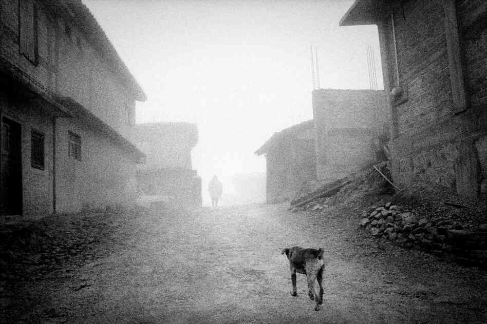 Fog settles on the deserted streets of San Miguel Cuevas, a Mixteca village in the highlands of Oaxaca. More than 80% of its population has emigrated to the United States, leaving it little more than a ghost town.
