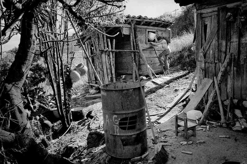A girl works at her family's farmhouse.