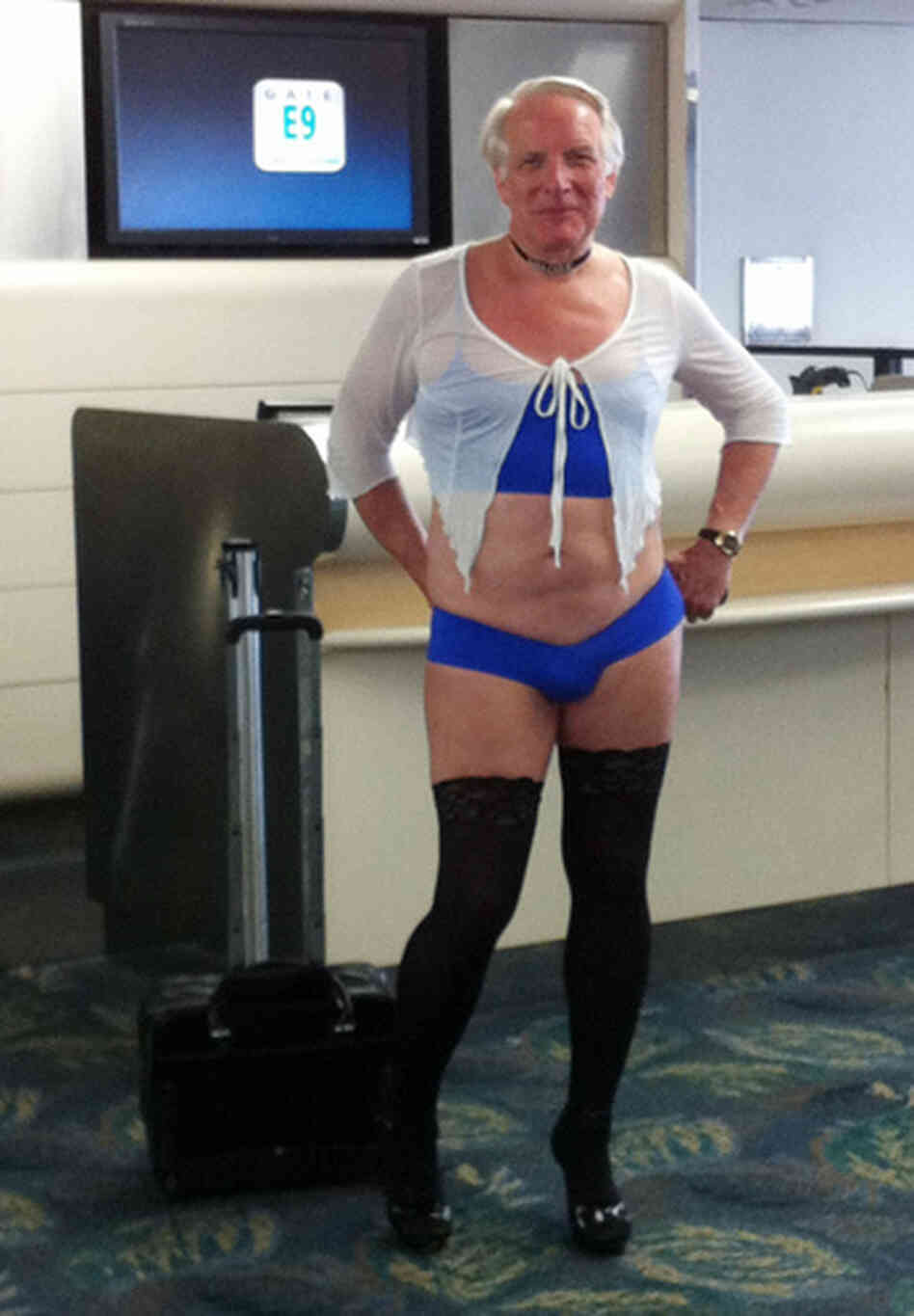 This is a June 9, 2011, photo provided by airline passenger Jill Tarlow showing an unnamed passenger scantily dressed and taken at the airport in Fort Lauderdale, Fla. This is a June 9, 2011, photo provided by airline passenger Jill Tarlow showing an unnamed passenger scantily dressed and taken at the airport in Fort Lauderdale, Fla.