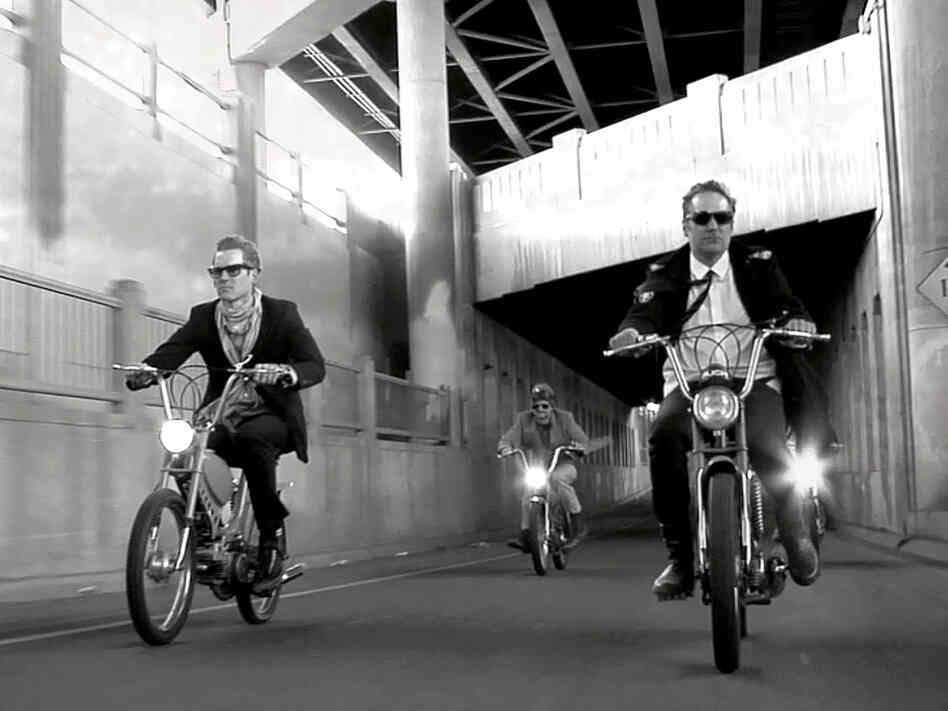 The video for DeVotchKa's "The Man From San Sebastian" includes a thrilling chase scene with the band's members on vintage mopeds. The video for DeVotchKa's "The Man From San Sebastian" includes a thrilling chase scene with the band's members on vintage mopeds.