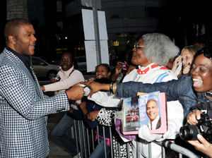Writer/producer/director/actor Tyler Perry (left) greets fans at a screening of Lionsgate Films' Tyler Perry's Madea's Big Happy Family at the Cinerama Dome Theater on April 19 in Los Angeles. Writer/producer/director/actor Tyler Perry (left) greets fans at a screening of Lionsgate Films' Tyler Perry's Madea's Big Happy Family at the Cinerama Dome Theater on April 19 in Los Angeles.