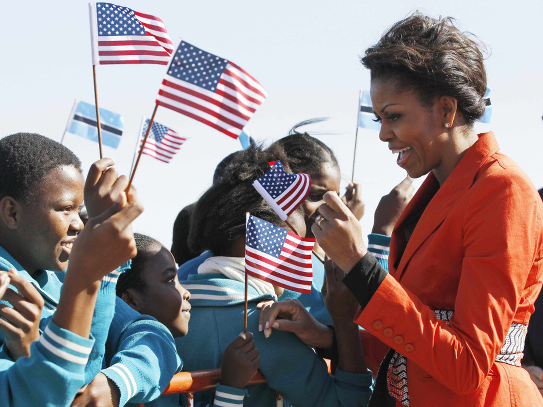 First lady Michelle Obama is greeted by children as she arrives in Gaborone, Botswana on June 24.