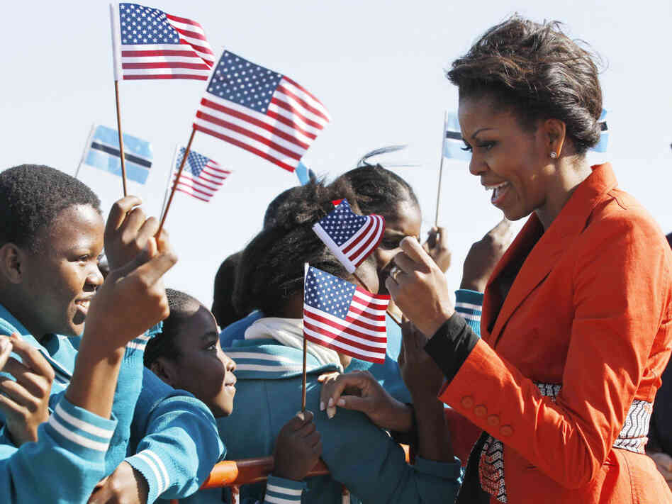 First lady Michelle Obama is greeted by children as she arrives in Gaborone, Botswana on June 24.