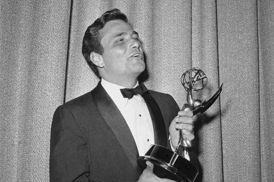 Falk admires the Emmy he won in 1962 for outstanding single performance by an actor, for his role in The Price of Tomatoes, a Dick Powell show. 