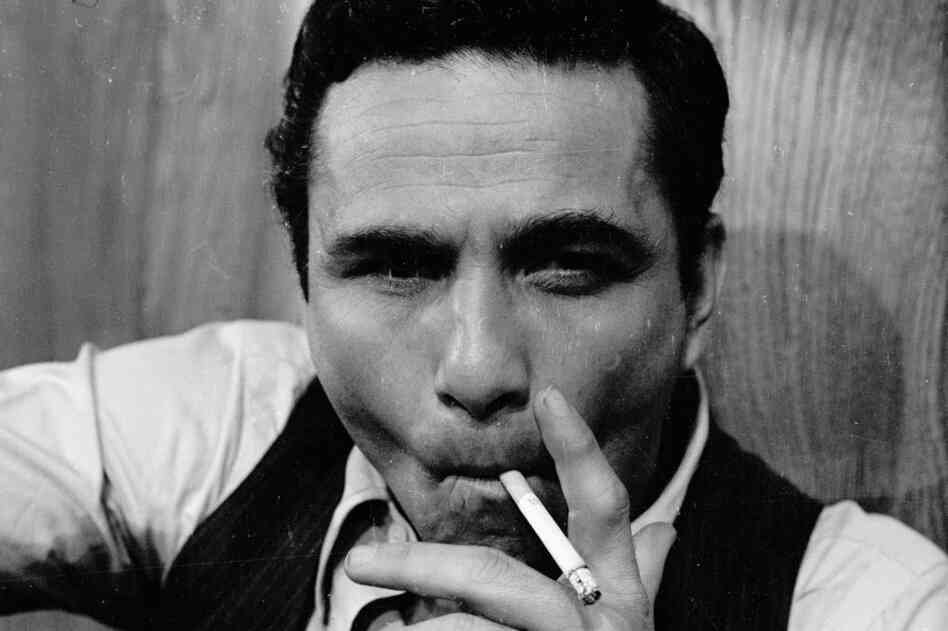 Falk poses for a photo in 1965. He was in several films and television shows before starring in the detective drama Columbo. 