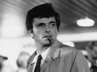 Peter Folk poses as his famed character, Lt. Columbo, in the detective television series Columbo. Peter Folk poses as his famed character, Lt. Columbo, in the detective television series Columbo.