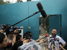 Activist artist Ai Weiwei speaks to journalists gathered outside his home in Beijing, China, Thursday. Activist artist Ai Weiwei speaks to journalists gathered outside his home in Beijing, China, Thursday.