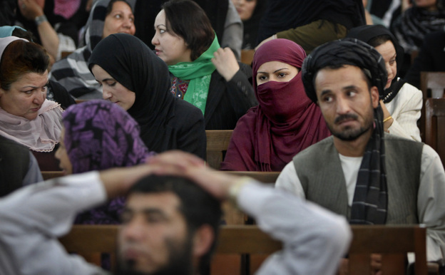 Defeated candidates from Afghanistan's September 2010 election wait for the resumption of proceedings of a special tribunal in a Kabul courtroom on Thursday. The tribunal decided that 62 members of Parliament would be replaced on fraud charges.