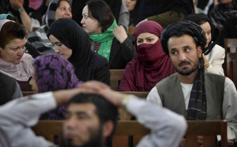 Defeated candidates from Afghanistan's September 2010 election wait for the resumption of proceedings of a special tribunal in a Kabul courtroom on Thursday. The tribunal decided that 62 members of Parliament would be replaced on fraud charges.