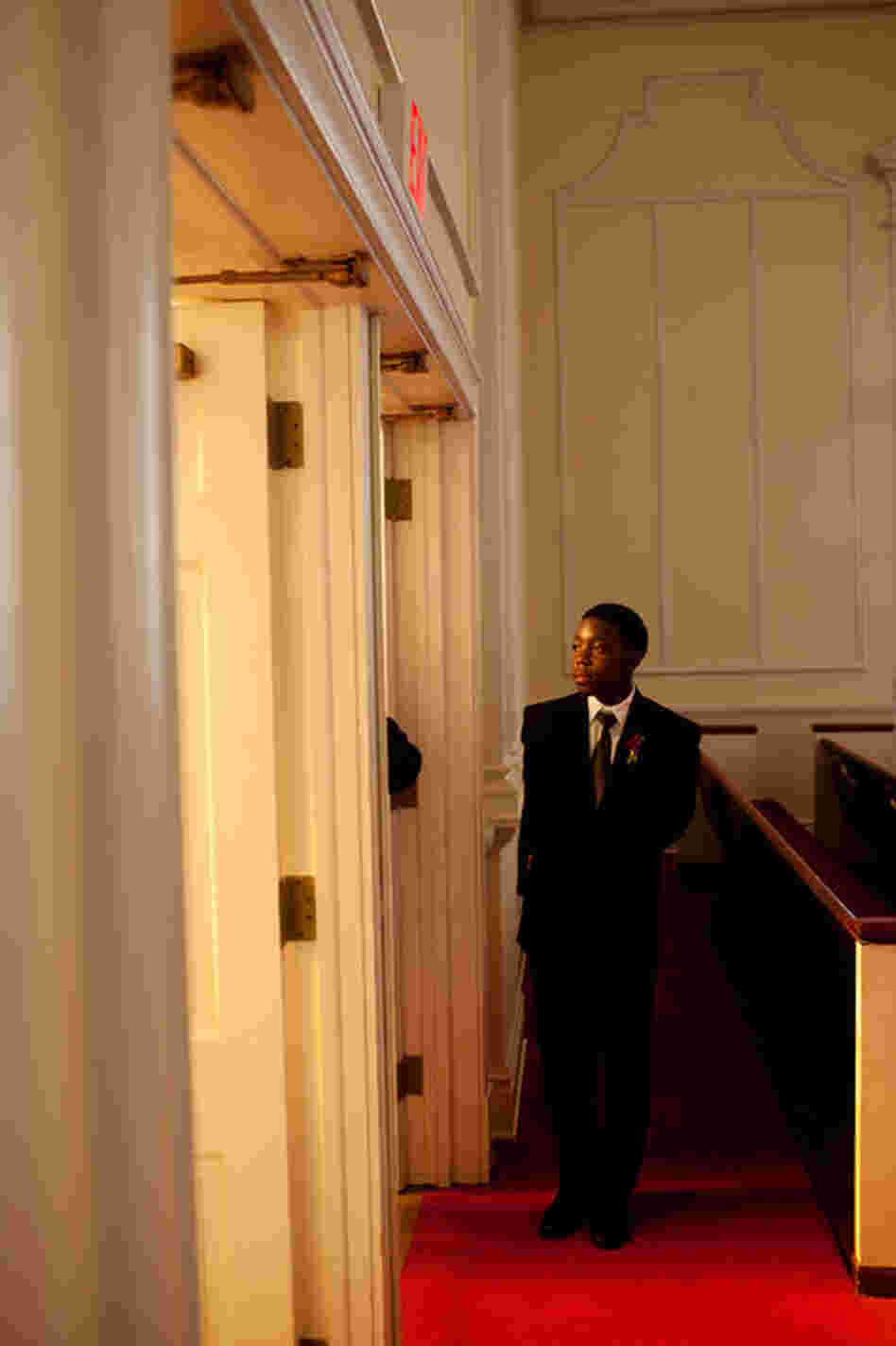 An usher awaits guests at a wedding at Sardis United Methodist Church in Atlanta.