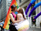 Two women celebrate the passage of New York's same-sex marriage law at Saturday's gay pride parade in New York City. Two women celebrate the passage of New York's same-sex marriage law at Saturday's gay pride parade in New York City.