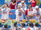 Competitive eaters down their frankfurters during the 2010 Nathan's Famous Fourth of July International Hot Dog Eating Contest at the original Nathan's Famous on Coney Island. Competitive eaters down their frankfurters during the 2010 Nathan's Famous Fourth of July International Hot Dog Eating Contest at the original Nathan's Famous on Coney Island.