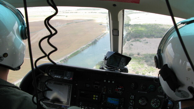 Texas Department of Public Safety pilots monitor the Rio Grande River near Los Ebanos, Texas. (NPR)