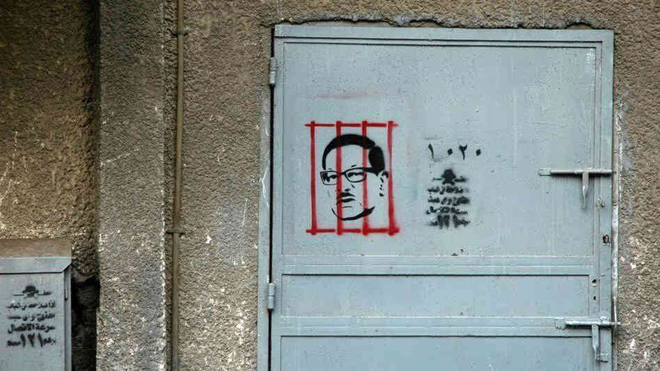 After the revolution, graphic artist Adham Bakry began stenciling the face of Safwat El Sherif, a member of Egypt's former ruling party, behind bars. El Sherif was arrested on corruption charges soon after. Bakry sees the rise of Cairo's street art as a push back against those who use the uprising as a marketing tool.
