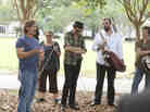 DJ Davis (Steve Zahn) address a crowd of musicians at Harley's memorial service on Treme.