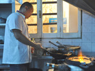 Chef Lao Wei Xiong cooks up a carry-out order for foreign reporters in the kitchen at al Maida restaurant in Tripoli. Chef Lao Wei Xiong cooks up a carry-out order for foreign reporters in the kitchen at al Maida restaurant in Tripoli.