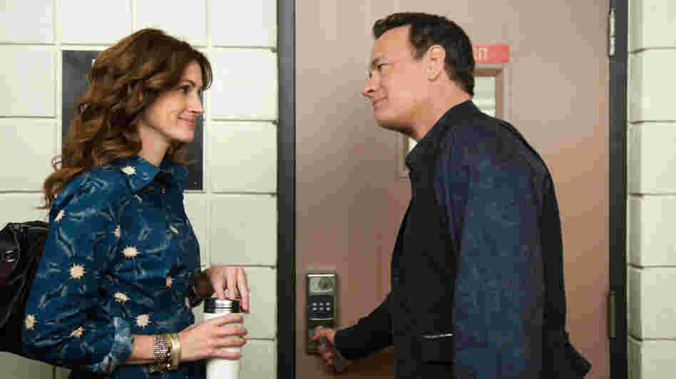 Hot For Teacher: Larry Crowne (Tom Hanks, right) woos his public speaking professor (Julia Roberts) in the midst of restarting his life after being laid off. Despite Roberts' lively performance, the film lacks enough emotional honesty to feel like an open reflection of current economic times. Hot For Teacher: Larry Crowne (Tom Hanks, right) woos his public speaking professor (Julia Roberts) in the midst of restarting his life after being laid off. Despite Roberts' lively performance, the film lacks enough emotional honesty to feel like an open reflection of current economic times.