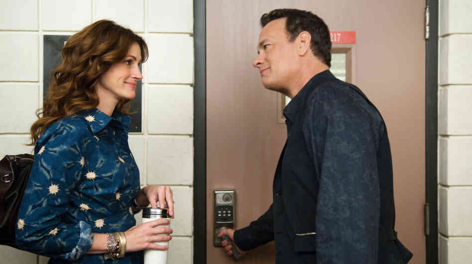 Hot For Teacher: Larry Crowne (Tom Hanks, right) woos his public speaking professor (Julia Roberts) in the midst of restarting his life after being laid off. Despite Roberts' lively performance, the film lacks enough emotional honesty to feel like an open reflection of current economic times. Hot For Teacher: Larry Crowne (Tom Hanks, right) woos his public speaking professor (Julia Roberts) in the midst of restarting his life after being laid off. Despite Roberts' lively performance, the film lacks enough emotional honesty to feel like an open reflection of current economic times.