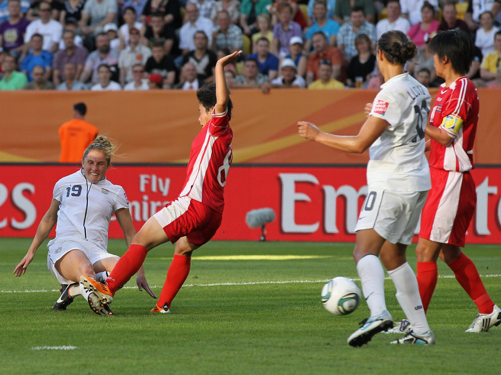 Rachel Buehler of the U.S., left, scores her team's second goal during the FIFA Women's World Cup Group C match between USA and Korea at Rudolf-Harbig-Stadion in Dresden, Germany.