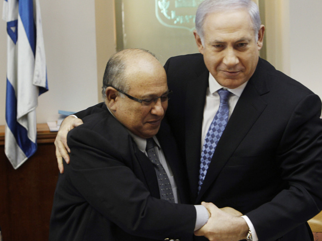 Israeli Prime Minister Benjamin Netanyahu hugs outgoing Mossad chief Meir Dagan after thanking him at the beginning of a Cabinet meeting in Jerusalem on Jan. 2.