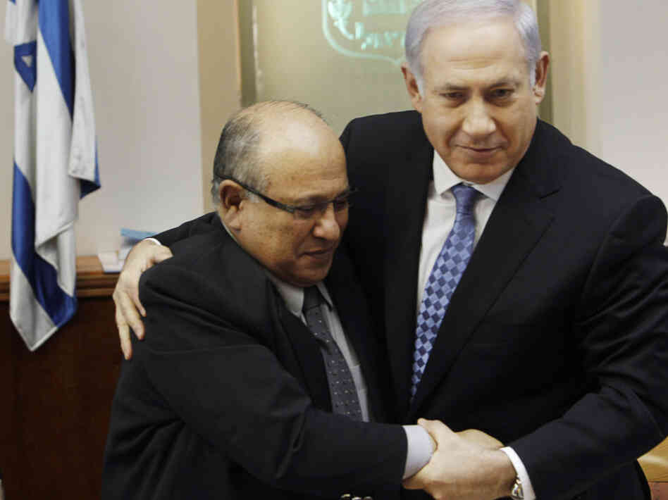 Israeli Prime Minister Benjamin Netanyahu hugs outgoing Mossad chief Meir Dagan after thanking him at the beginning of a Cabinet meeting in Jerusalem on Jan. 2.
