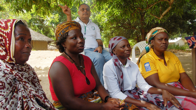 Cassimo Bique, an OB-GYN, sits with traditional birth attendants in Mozambique. Bique is an advocate for the drug misoprostol, which can prevent postpartum hemorrhaging in women.
