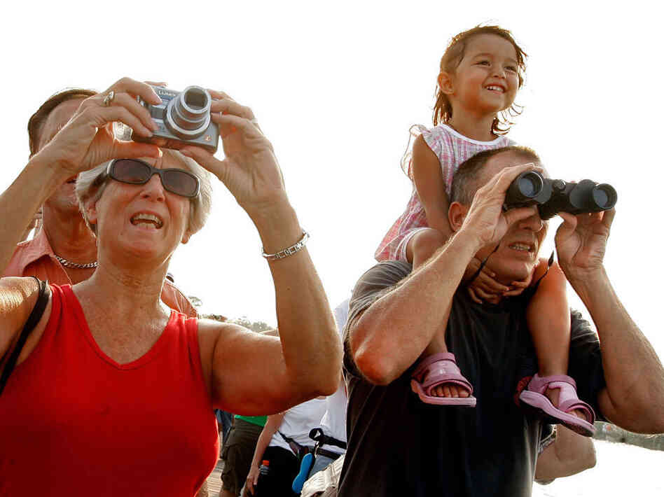 Spectators watch from the Rotary Riverfront Park pier as Space Shuttle Endeavour launches from Kennedy Space Center Aug. 8, 2007. Spectators watch from the Rotary Riverfront Park pier as Space Shuttle Endeavour launches from Kennedy Space Center Aug. 8, 2007.