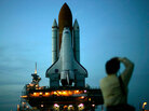 The Space Shuttle Discovery is moved down the 'crawlerway' to launch pad 39B at sunset during its rollout for mission STS-114 at the Kennedy Space Center April 6, 2005 in Cape Canaveral, Fla. The Space Shuttle Discovery is moved down the 'crawlerway' to launch pad 39B at sunset during its rollout for mission STS-114 at the Kennedy Space Center April 6, 2005 in Cape Canaveral, Fla.