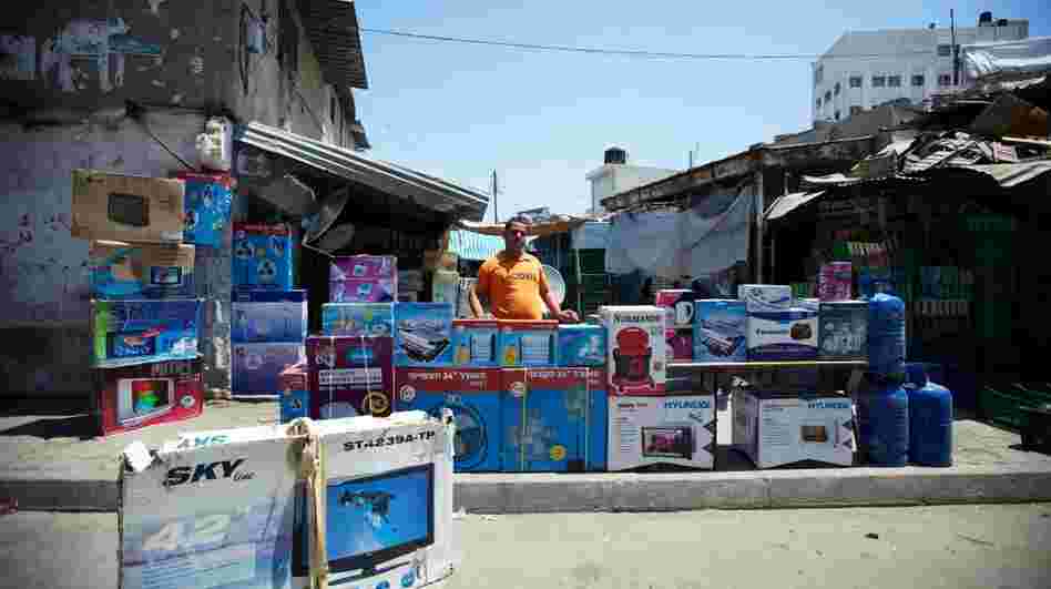 A store owner in a Gaza City market. Israel has eased the blockade of Gaza over the past year, and more commercial goods are reaching the territory. A store owner in a Gaza City market. Israel has eased the blockade of Gaza over the past year, and more commercial goods are reaching the territory.