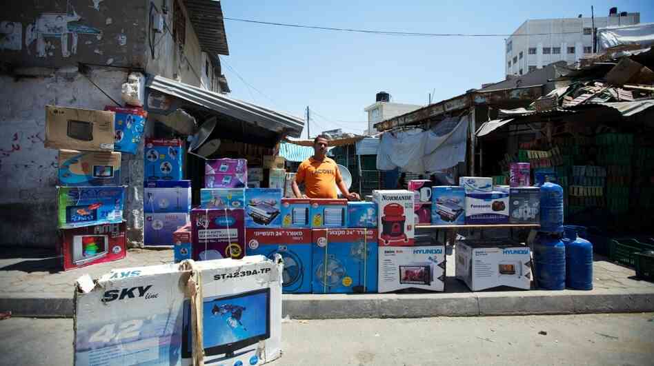A store owner in a Gaza City market. Israel has eased the blockade of Gaza over the past year, and more commercial goods are reaching the territory. A store owner in a Gaza City market. Israel has eased the blockade of Gaza over the past year, and more commercial goods are reaching the territory.