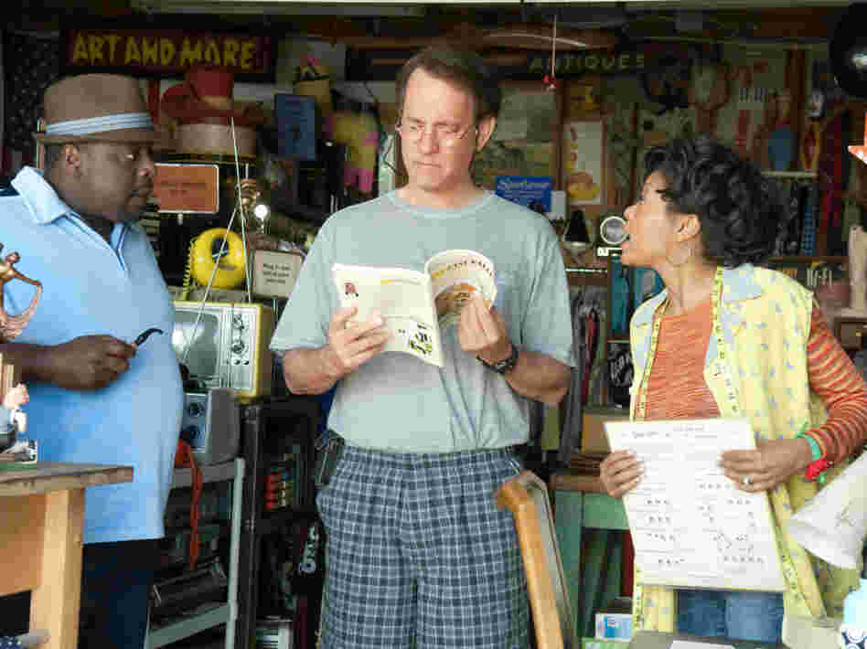 Cedric the Entertainer (from left), Tom Hanks and Taraji P. Henson demonstrate the virtues of thrift stores and garage sales, but the film's design for living doesn't connect.