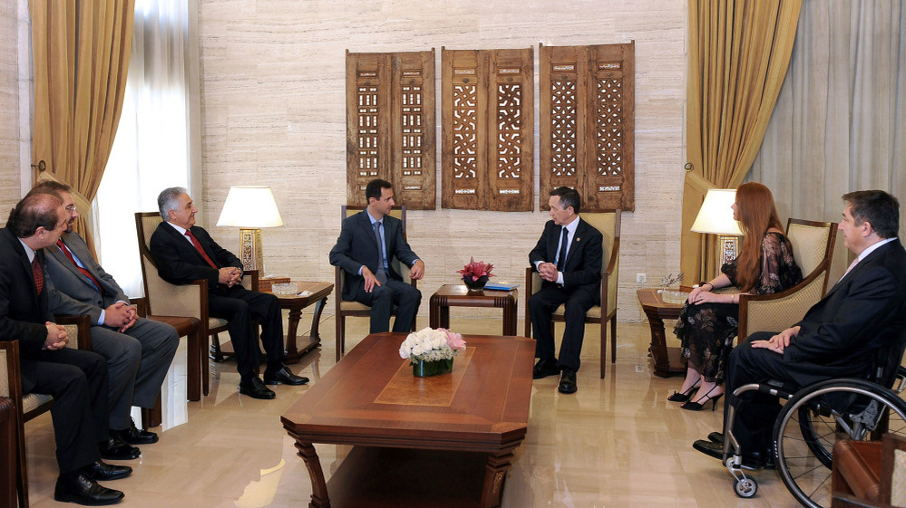 A handout picture released by the Syrian Arab News Agency (SANA) shows Syria's President Bashar al-Assad meeting with U.S. Congressman Dennis Kucinich and his delegation in Damascus.