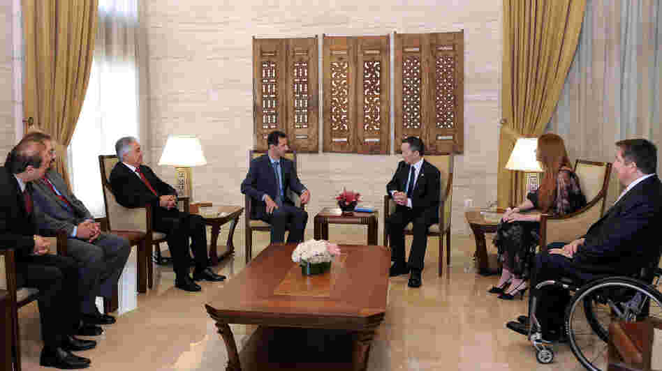 A handout picture released by the Syrian Arab News Agency (SANA) shows Syria's President Bashar al-Assad meeting with U.S. Congressman Dennis Kucinich and his delegation in Damascus.