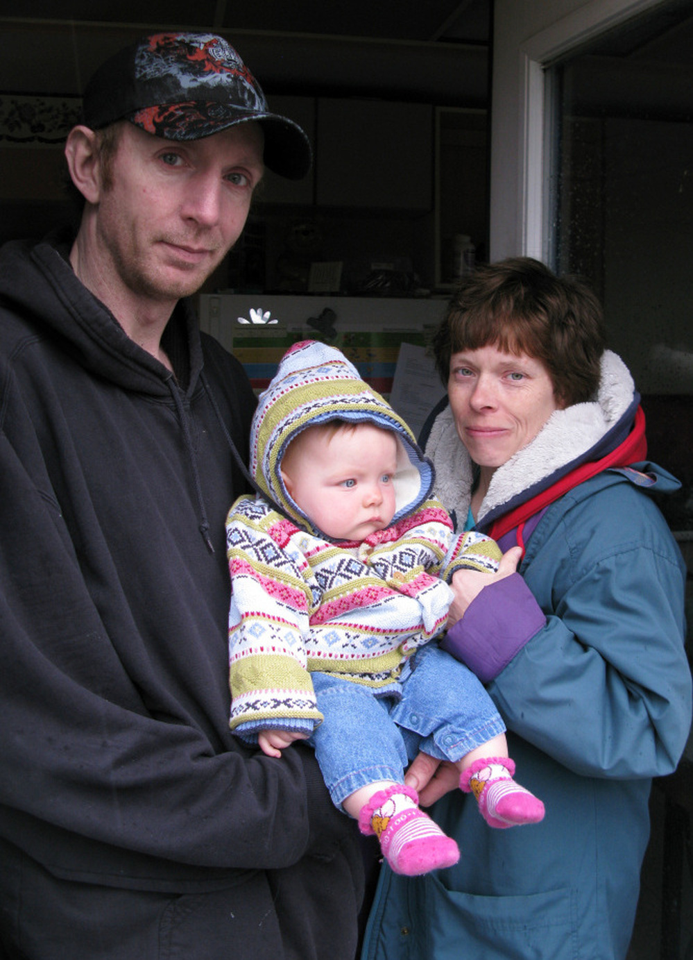 Tammy Marquardt with her fiancee, Rick Hanley, and their daughter, Tiffany.