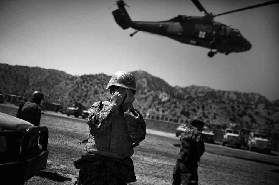 A U.S. Army medevac helicopter lifts off, carrying the injured Afghan soldier. Taliban insurgents fired at least 12 mortar rounds at the base from a mountaintop across the valley.