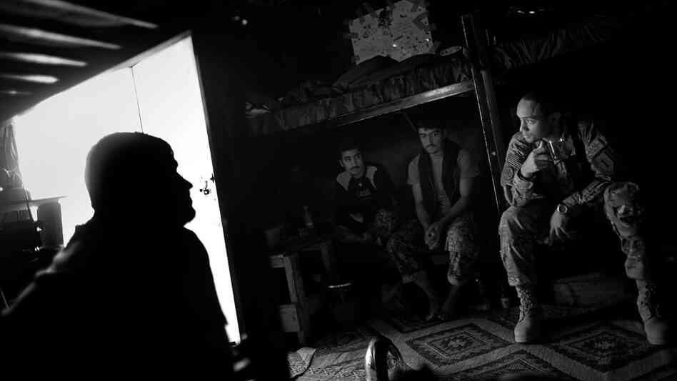 Capt. Jerry Lee Wood, with Butcher Troop, has tea with some of his Afghan National Army soldiers at their mountaintop guard quarters. "Being at Combat Outpost Wilderness is like being part of the U.S. Cavalry in the American West during the 19th century," Wood says.