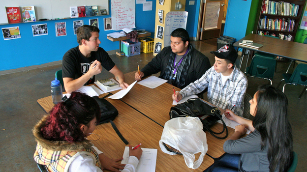 Civics teacher Devin Carberry talks about the bystander effect in relation to the Holocaust with his high school class at the ARISE Charter School in Oakland, Calif. Civics teacher Devin Carberry talks about the bystander effect in relation to the Holocaust with his high school class at the ARISE Charter School in Oakland, Calif.
