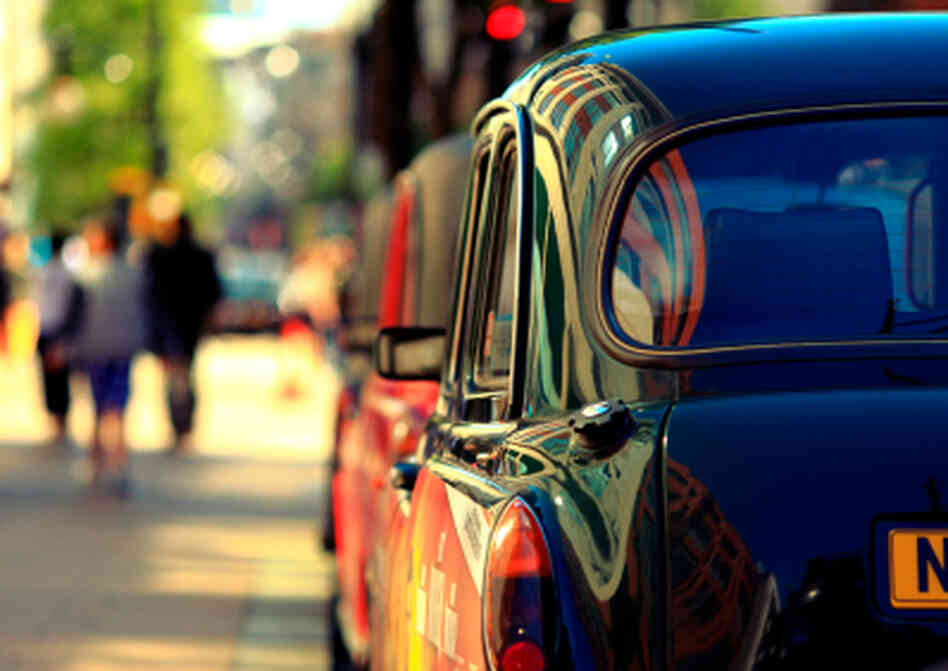 A cab parked on the street A cab parked on the street